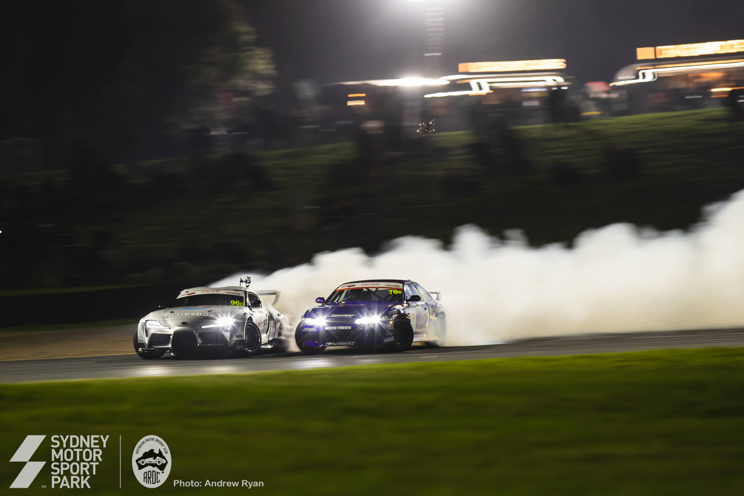 Drift smoke rising under the night lights