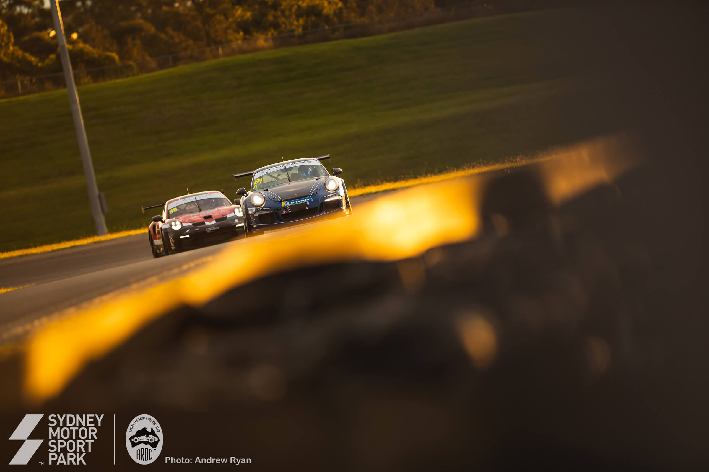 Cars cresting the southern rise at golden hour