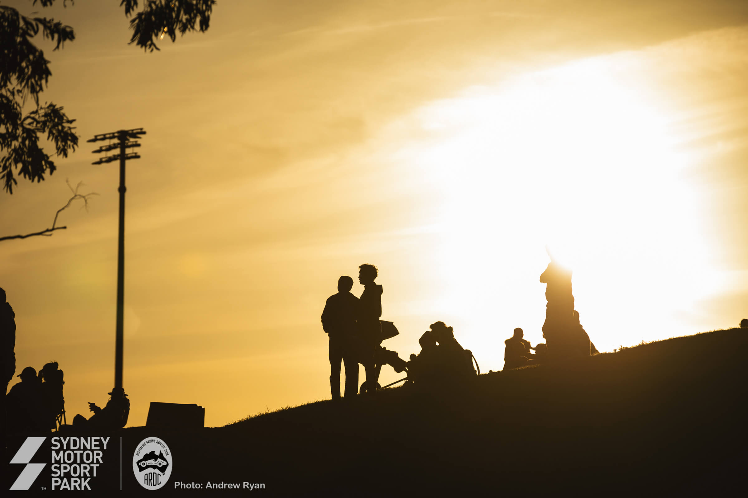 Spectators and families watching at golden hour